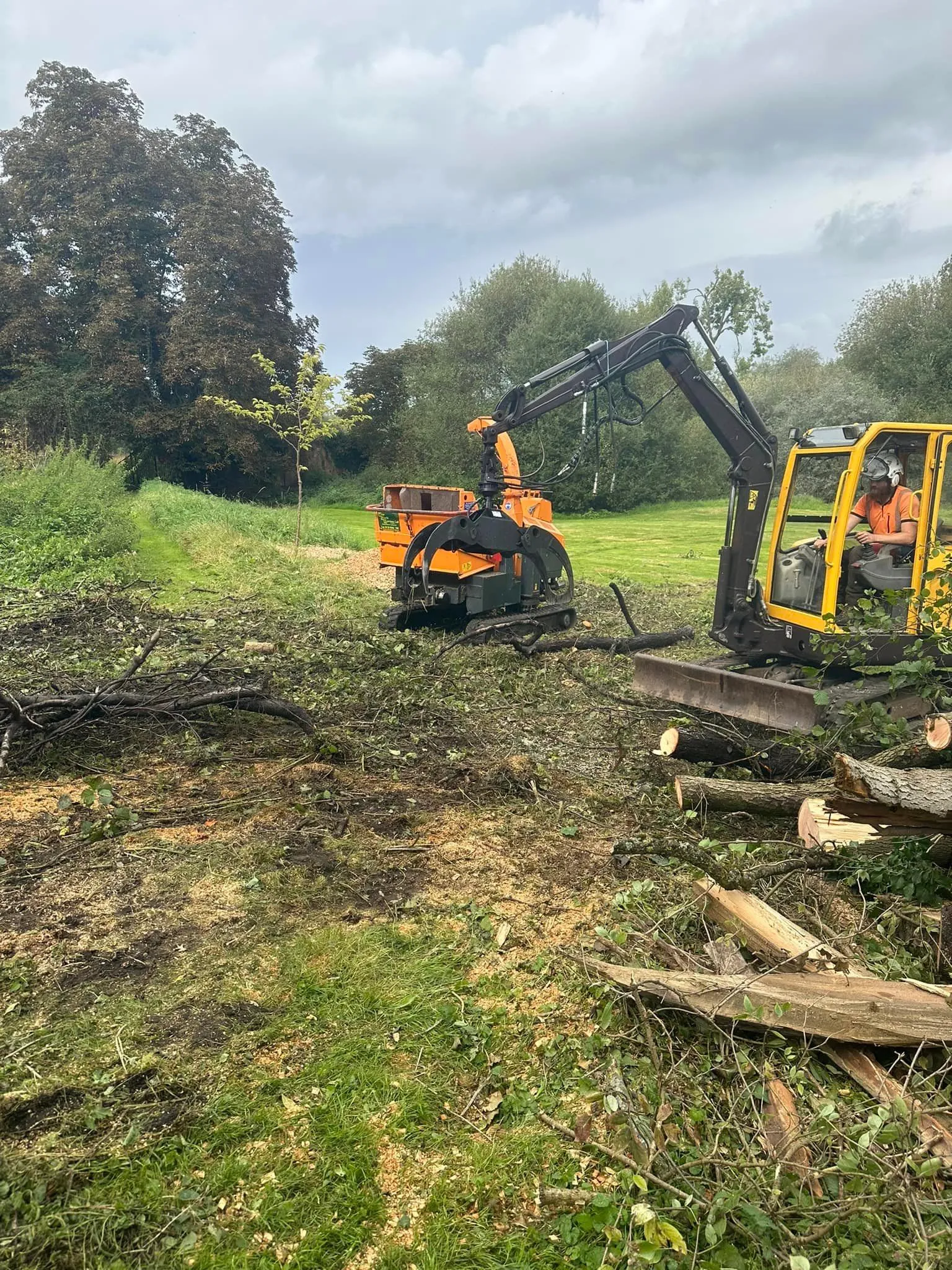 A couple of machines that are in the grass.